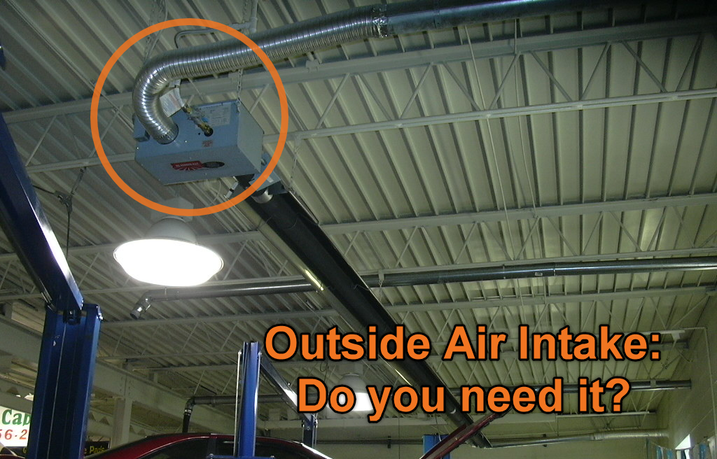 Outside combustion air intake for radiant heaters showing burner box and intake duct in shop ceiling